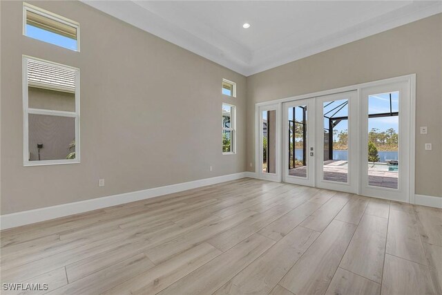 8871 Nevis Way, Naples, FL 34112 - spare room with recessed lighting, baseboards, french doors, and light wood-style floors