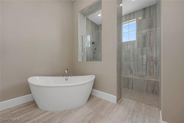 bathroom with separate shower and tub