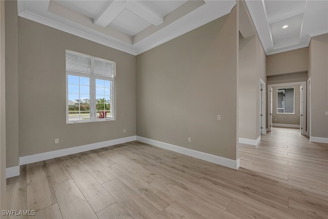 unfurnished room with light hardwood / wood-style flooring, ornamental molding, beamed ceiling, and a high ceiling