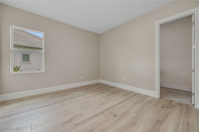 empty room with light wood-type flooring