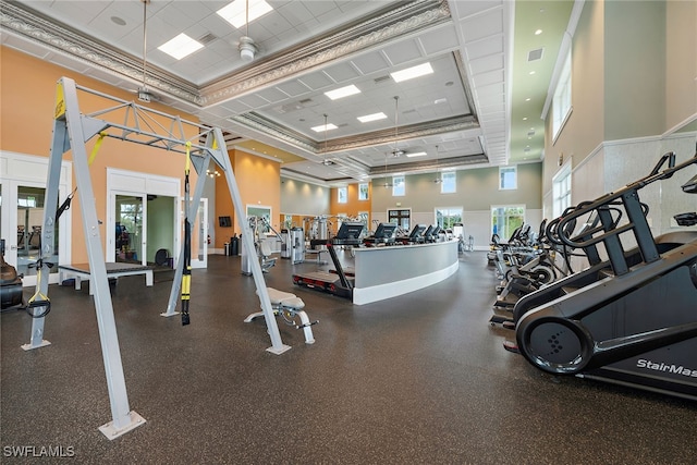 gym featuring a towering ceiling