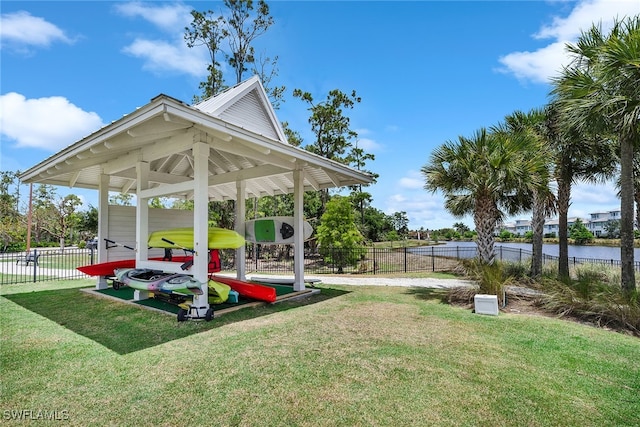 view of yard with a playground and a water view