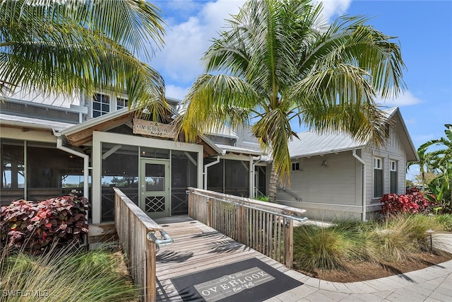 view of front of house with a sunroom