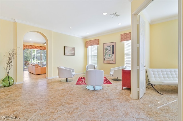 playroom with ornamental molding and light tile patterned floors