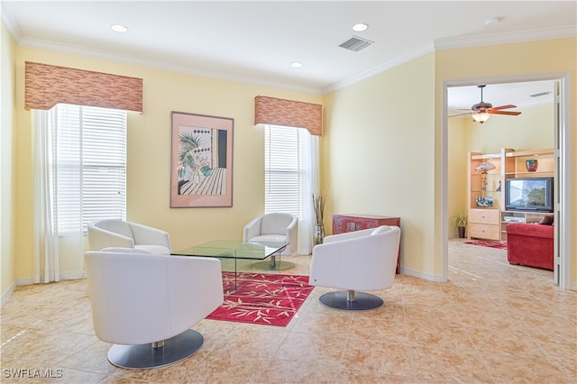 living area featuring ornamental molding, light tile patterned floors, and ceiling fan