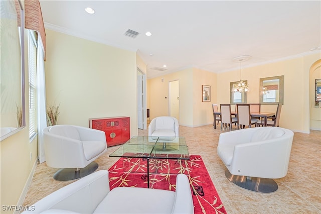 tiled living room with an inviting chandelier and crown molding