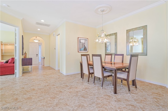 dining space featuring an inviting chandelier, crown molding, and light tile patterned floors