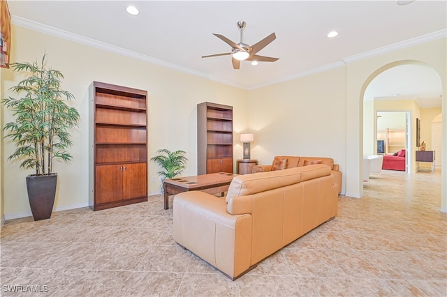 living room with crown molding, ceiling fan, and light tile patterned floors