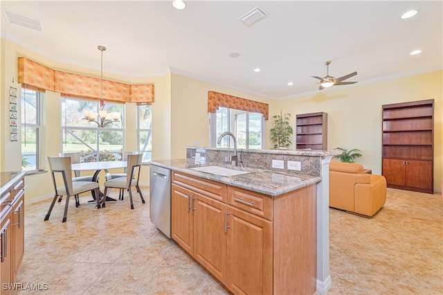 kitchen with sink, light stone countertops, a center island, decorative light fixtures, and stainless steel dishwasher