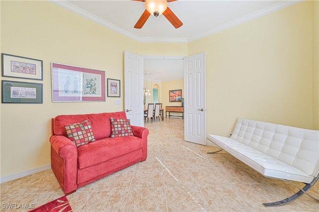 tiled living room with crown molding and ceiling fan