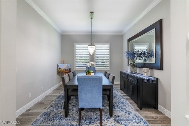 dining room featuring ornamental molding and hardwood / wood-style flooring