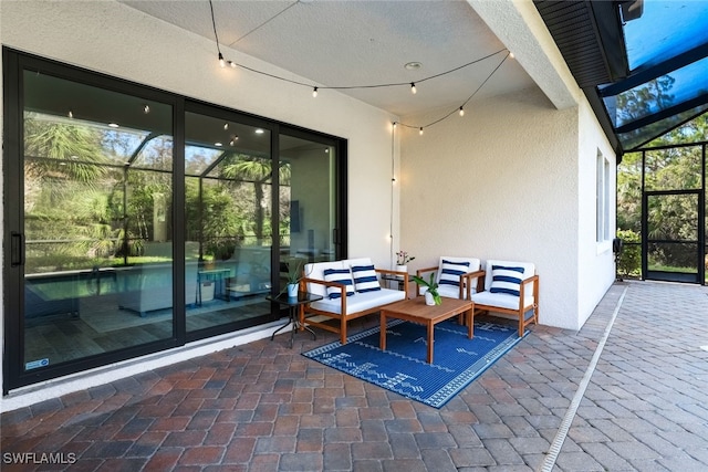 view of patio with glass enclosure