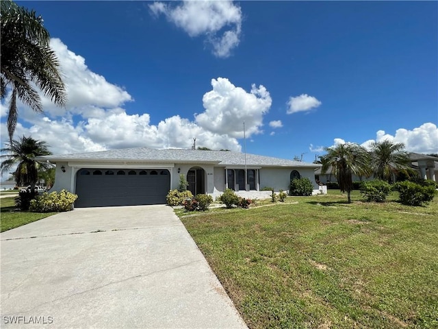 ranch-style house with a garage and a front lawn