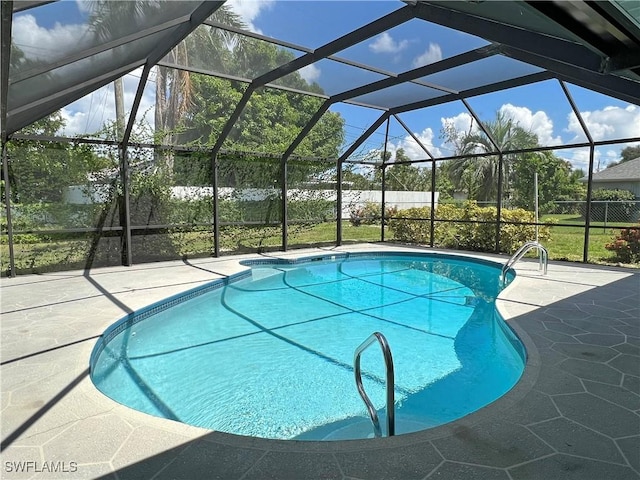 view of pool featuring a lanai and a patio area