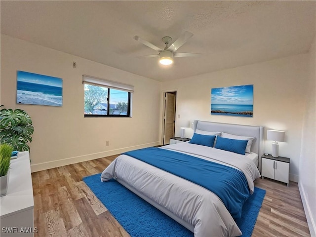 bedroom featuring ceiling fan and light wood-type flooring