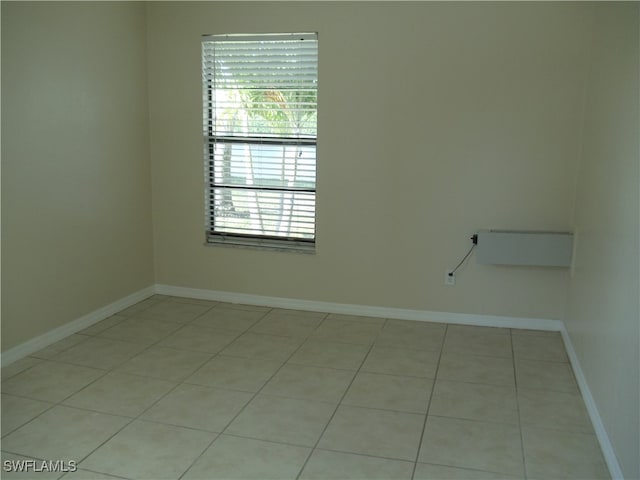 spare room with light tile patterned floors