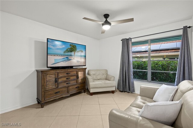 tiled living room with ceiling fan