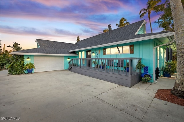 view of front facade featuring a garage and covered porch