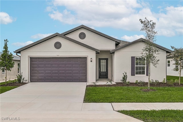 single story home featuring a front lawn and a garage