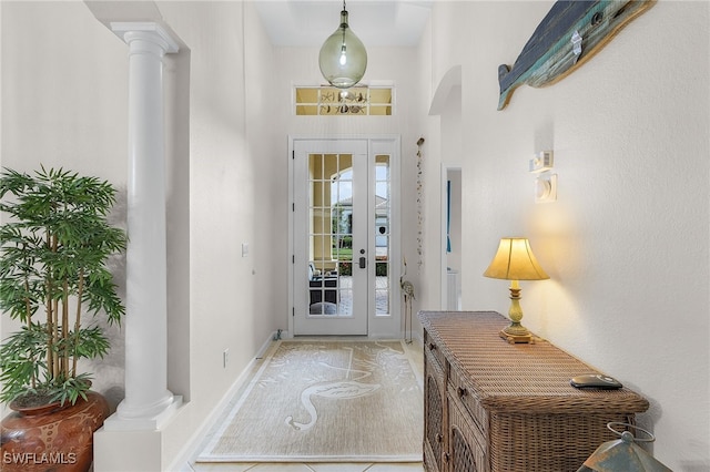 foyer entrance featuring decorative columns