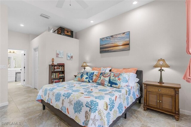 bedroom with ceiling fan and ensuite bath