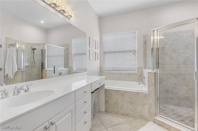 bathroom with vanity, tile patterned floors, and independent shower and bath