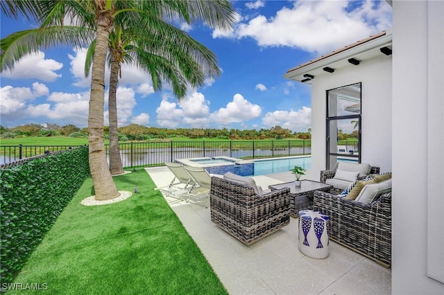 view of patio featuring outdoor lounge area, a water view, and a fenced in pool