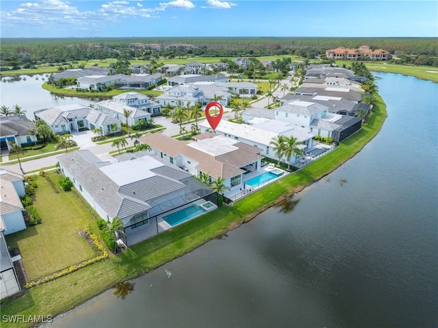 drone / aerial view with a water view