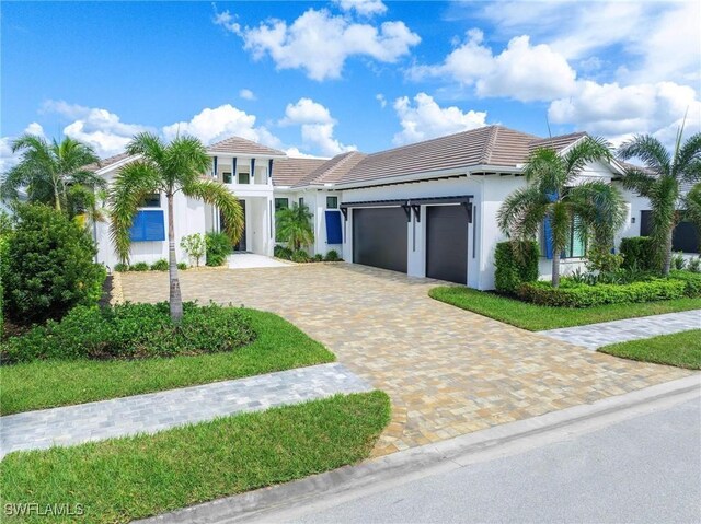 view of front of property with a garage