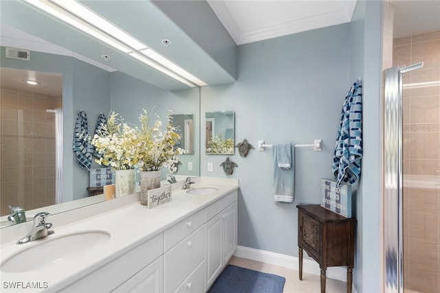 bathroom featuring vanity, ornamental molding, and a shower with door