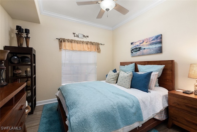 bedroom with ceiling fan, ornamental molding, and dark hardwood / wood-style floors