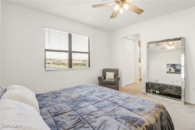 carpeted bedroom with a closet and ceiling fan