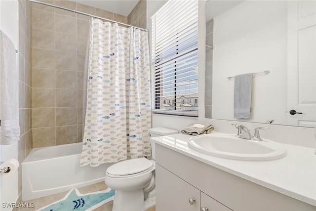 full bathroom with toilet, shower / bath combo, vanity, and tile patterned floors