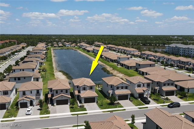 birds eye view of property with a water view