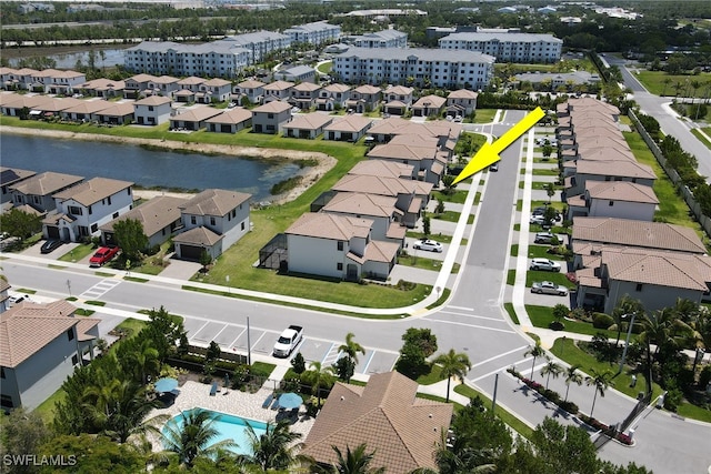 birds eye view of property with a water view