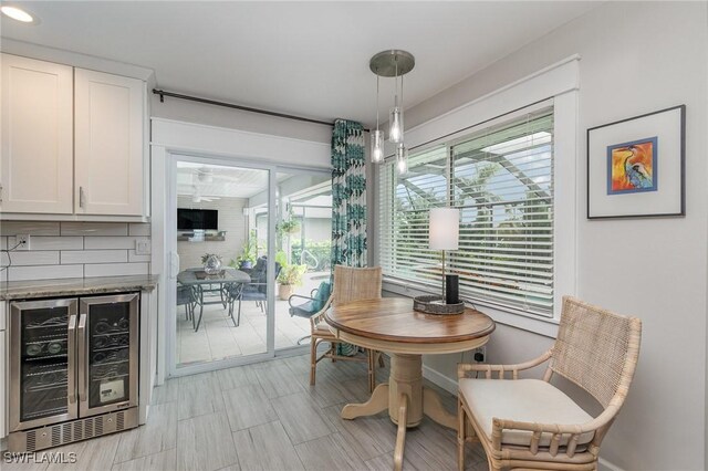 dining area with bar and wine cooler