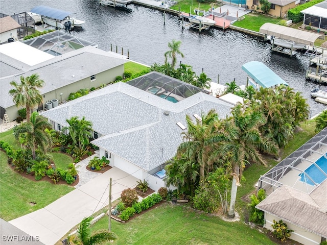 birds eye view of property with a water view