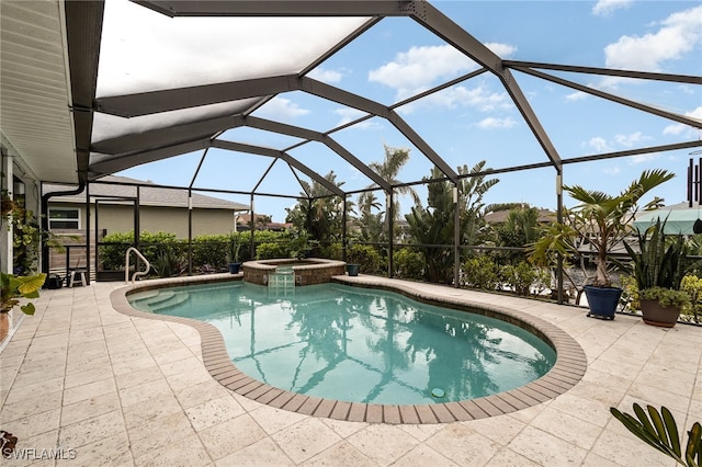 view of swimming pool with glass enclosure, an in ground hot tub, and a patio