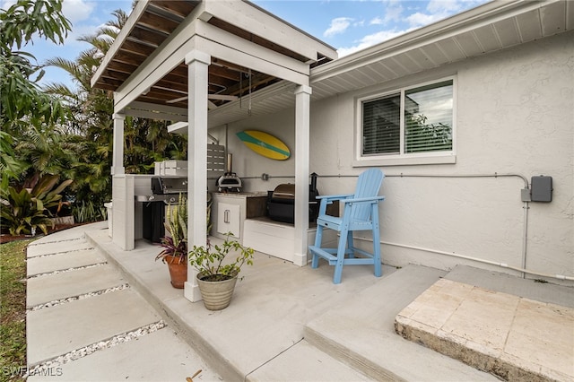 view of patio with exterior kitchen and grilling area