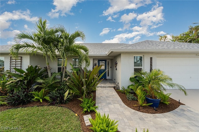 single story home with a garage