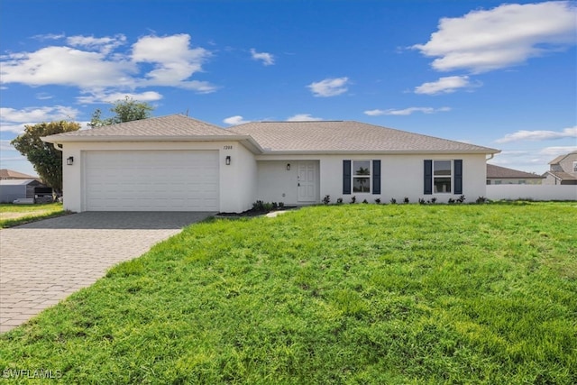 single story home with a front yard and a garage