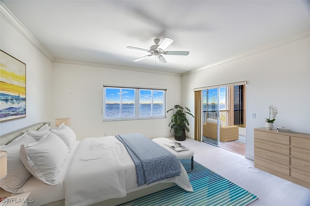 carpeted bedroom featuring ceiling fan and crown molding