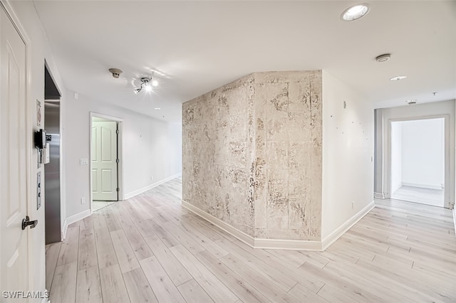 empty room with light wood-type flooring