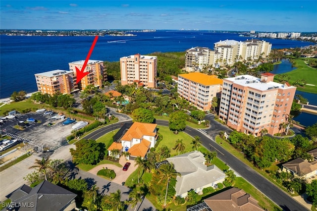 birds eye view of property featuring a water view