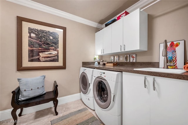 laundry area with ornamental molding, sink, light tile patterned floors, washer and dryer, and cabinets