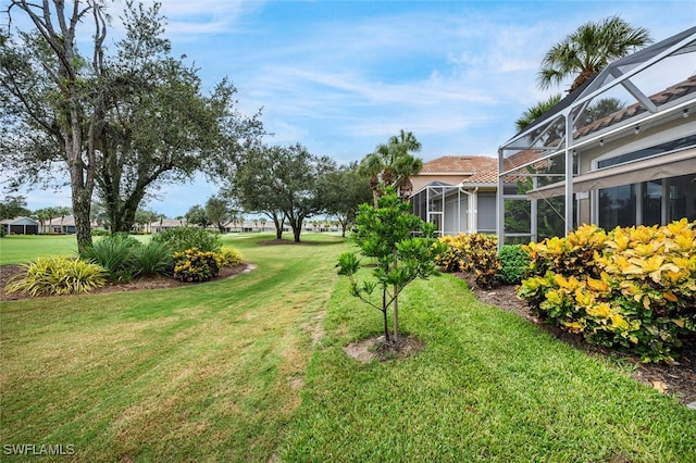 view of yard featuring a lanai