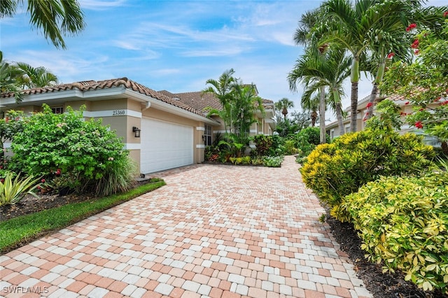 view of side of property with a garage