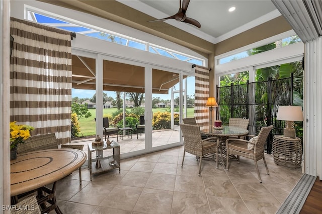 sunroom featuring ceiling fan