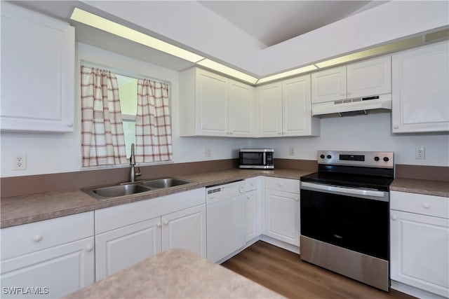 kitchen featuring white cabinets, appliances with stainless steel finishes, and sink