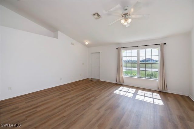 unfurnished room featuring ceiling fan, dark hardwood / wood-style floors, and lofted ceiling